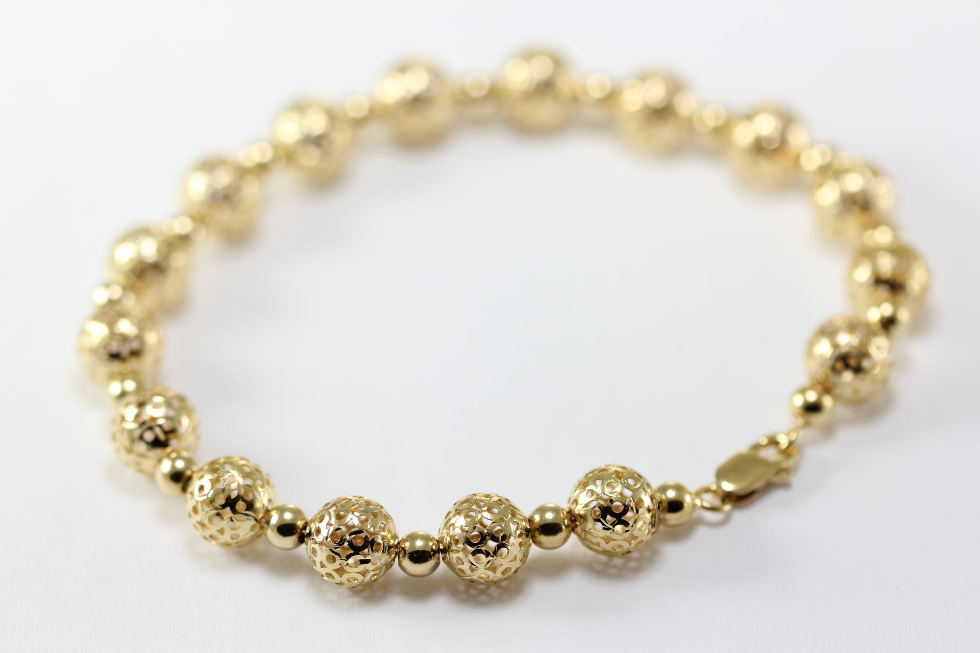 14K YELLOW GOLD FANCY BEADS BRACELET