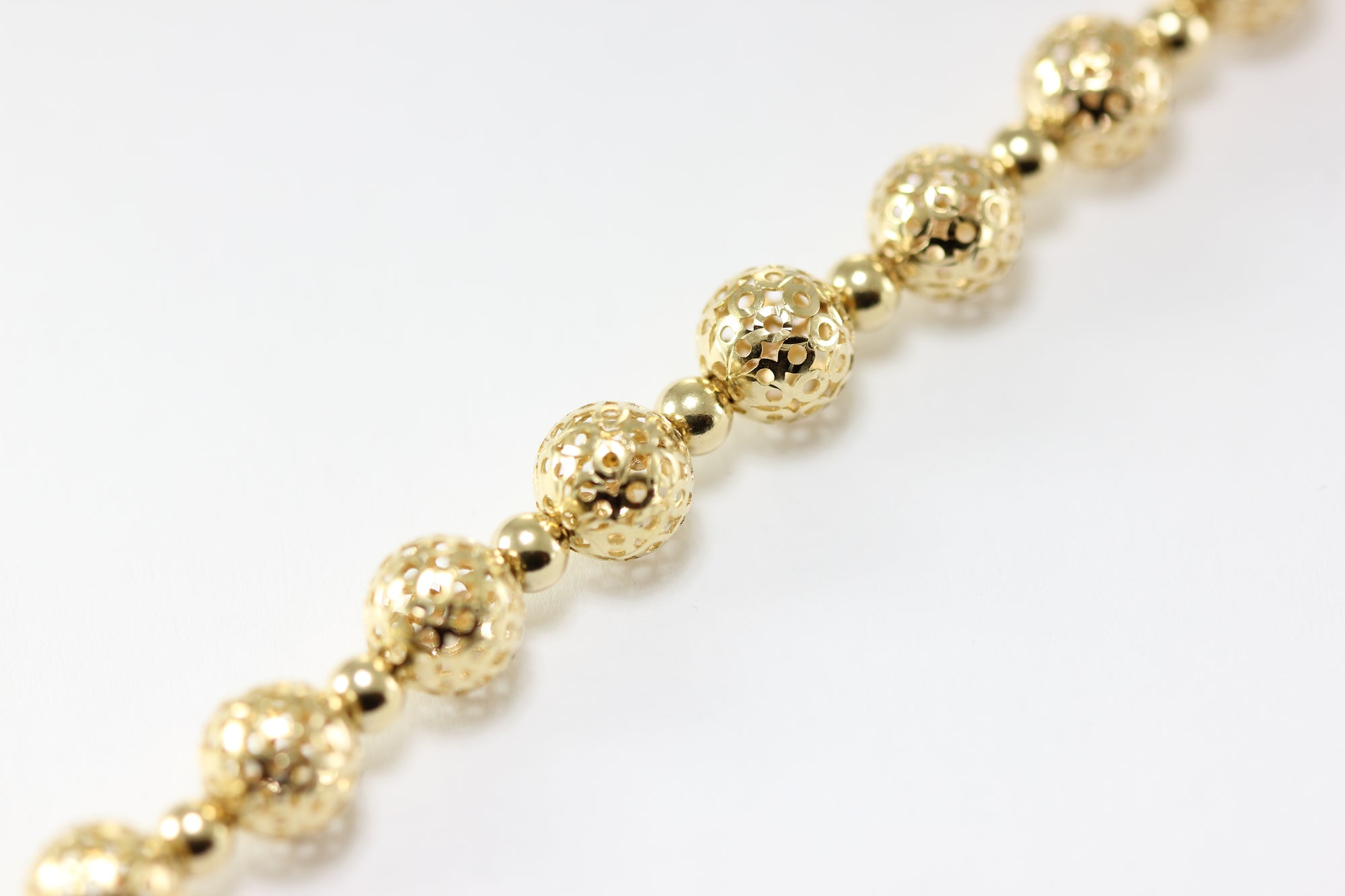 14K YELLOW GOLD FANCY BEADS BRACELET