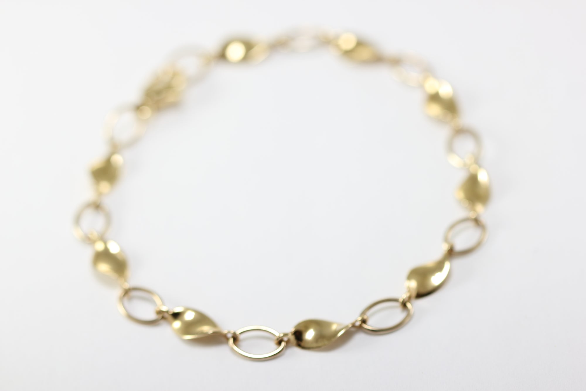 14K YELLOW GOLD TWIST LINK BRACELET