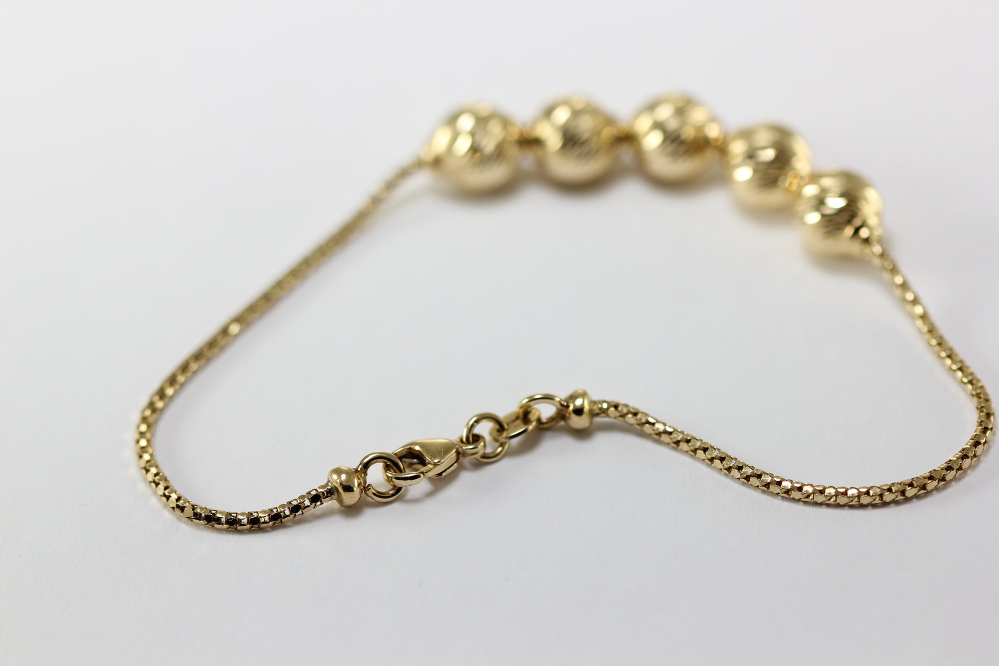 ABC 14K YELLOW GOLD LADIES SHINY DIAMOND CUT BEADED BRACELET