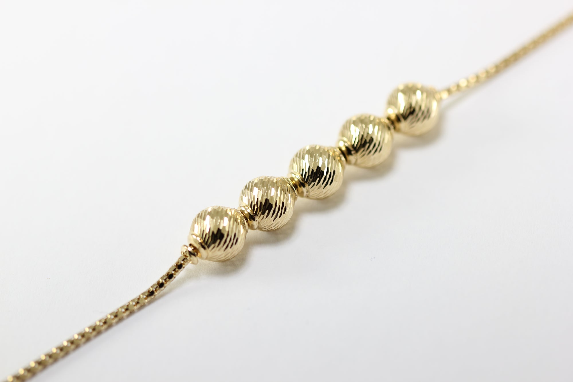 ABC 14K YELLOW GOLD LADIES SHINY DIAMOND CUT BEADED BRACELET