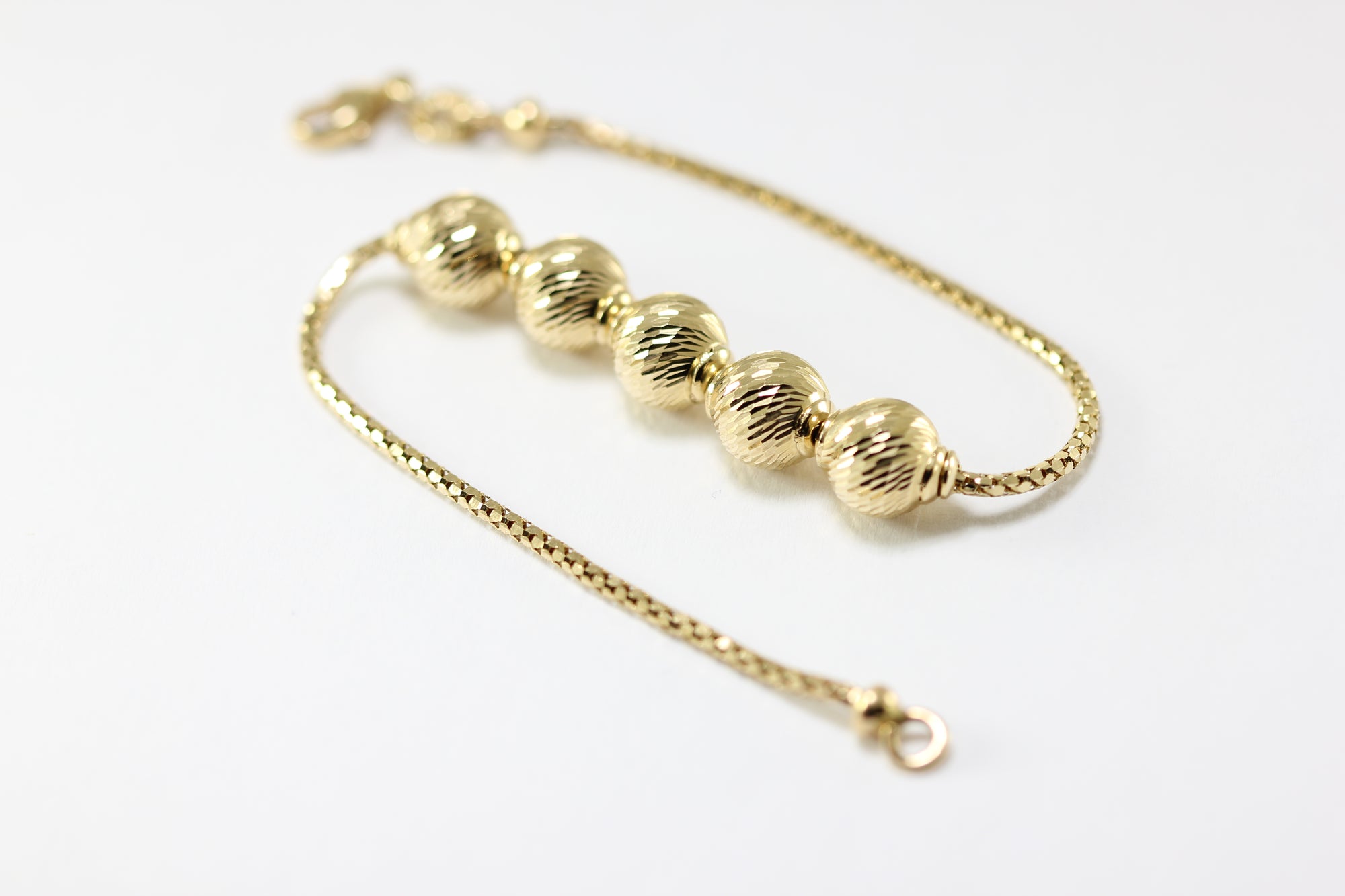 ABC 14K YELLOW GOLD LADIES SHINY DIAMOND CUT BEADED BRACELET