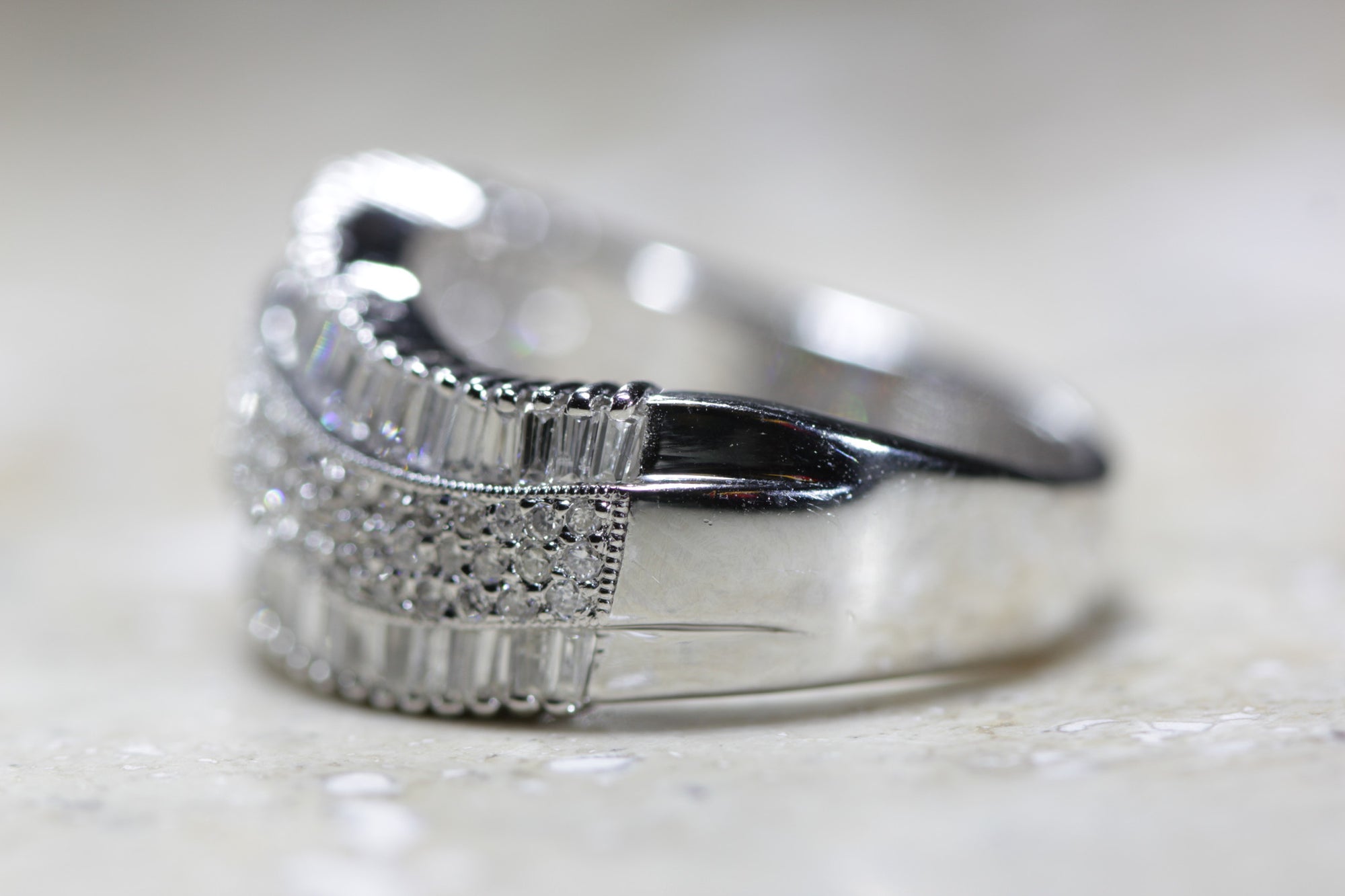 LADIES SWIRL DIAMOND WEDDING BAND ROUND AND BAGUETTES 14K W GOLD