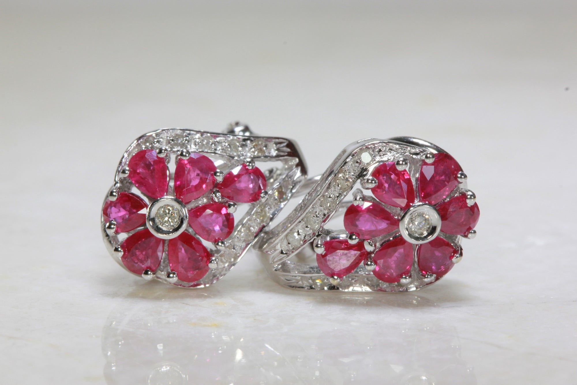 RUBY & DIAMOND FLOWER EARRINGS IN 14k WHITE GOLD SETTING