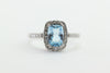 CHECKERBOARD SWISS BLUE TOPAZ DIAMOND HALO SET IN 14k WHITE GOLD RING